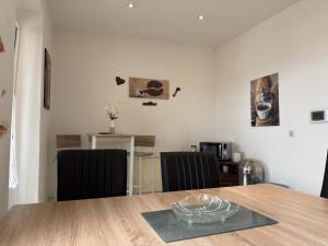 a dining room with a table and two chairs at Ferienwohnung in Ballenstedt in Ballenstedt