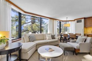 a living room with a couch and tables and chairs at Resort Perks! Everline Corner Retreat w/ 3 Units in Olympic Valley
