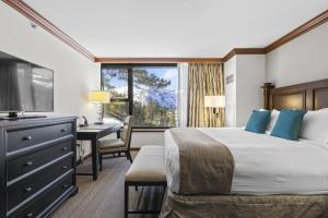 a bedroom with a bed and a desk and a window at Resort Perks! Everline Corner Retreat w/ 3 Units in Olympic Valley +36 photos