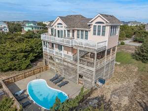 an aerial view of a house with a swimming pool at Sea Spray in Waves
