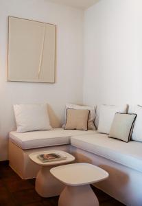 a living room with a couch and a table at Beautiful villa with private pool and mountain views in Jimena de la Frontera