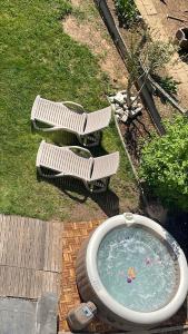 an overhead view of a swimming pool with two benches at Always luxury for a luxurious life in Grimbergen