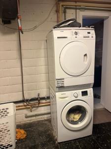 a washing machine and a washer in a room at Always luxury for a luxurious life in Grimbergen