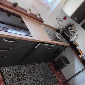 a kitchen with a counter with a laptop on it at Alloggio Veronica in Voghera