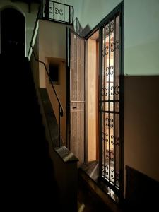 an entrance to a building with a staircase and a door at Le Cantine della Nelli in Genoa