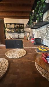 a kitchen with two circular tables and a counter at Le Cantine della Nelli in Genoa