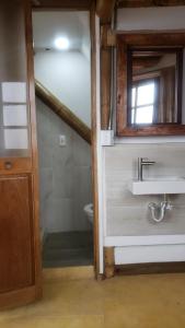 a bathroom with a sink and a toilet at Torre de Guadua in Medellín