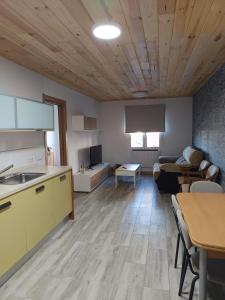 a kitchen and living room with a couch and a table at Casa Patio Zamora in Zamora