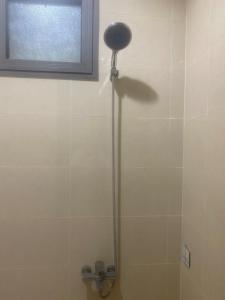 a shower in a bathroom with a window at شـقـة بغـرفـتـيـن Two rooms in Al Kharj +7 photos