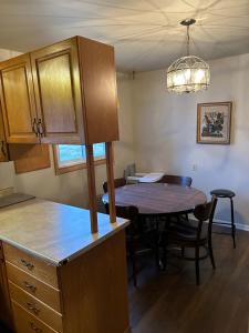 a kitchen and dining room with a table at Home sweet home in Thunder Bay