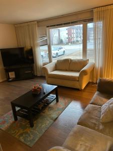 a living room with a couch and a coffee table at Home sweet home in Thunder Bay