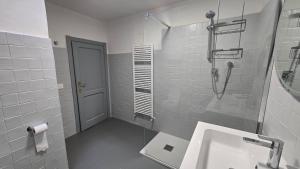a bathroom with a sink and a shower at Fontana Maggiore View Suite in Perugia +32 photos