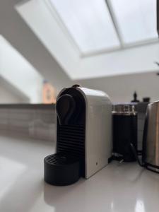 a toaster sitting on top of a counter at Penthouse Studio in Stockholm +10 photos