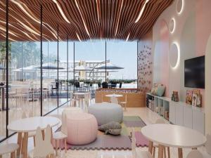 a restaurant with tables and chairs and a large window at Flat em Porto life Resort in Porto De Galinhas