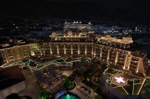 an aerial view of a resort at night at Merit Crystal Cove Hotel Casino & SPA in Kyrenia