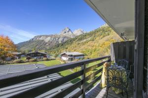 a balcony with a view of a mountain at Résidence Igloo in Le Tour +16 photos