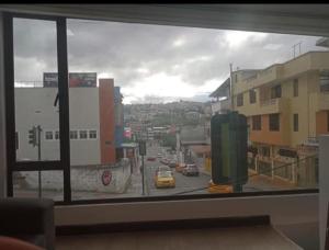 a view of a city street from a window at Duplex de la Sucre in Loja