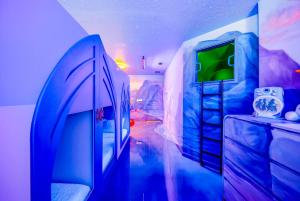 a room with a bed and a tv in it at Windsor Resort Private Pool & Theater Game Room in Davenport +72 photos