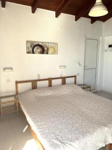 a bedroom with a bed in a room at Blue Sea in Ierapetra