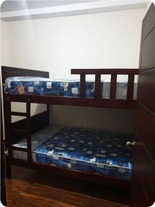 two bunk beds in a room with a door at CRUCITALIA suite x 4 in Crucita