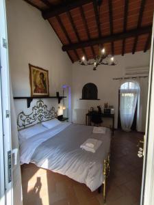 a bedroom with a large bed in a room at Il Quercetino di Momo in Ravenna