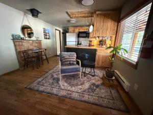 a kitchen with a table and a chair in a room at Miller Cabin in McCall