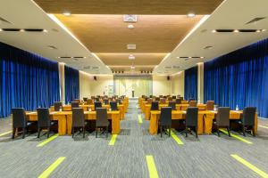 a conference room with wooden tables and chairs at Paeva Luxury By Nakra Functionality in Bang Bo +52 photos