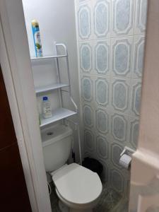 a small bathroom with a toilet and a wall at Acogedor apartamento en Anapoima in Anapoima +17 photos
