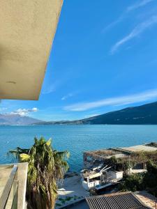 a view of the ocean from a house at Beachfront Bliss in Đenovići