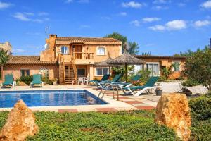 a villa with a swimming pool and a house at 409 Villa Can Bril ETV1523 by Mallorca Charme in Campos