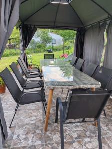 a group of chairs and a table in a tent at Vila Biva in Vrčin