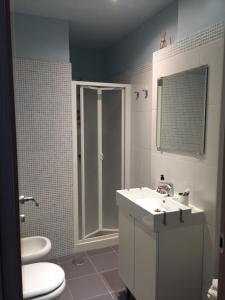 a bathroom with a sink and a toilet and a shower at B&B Sorgente 23 in Salerno +46 photos