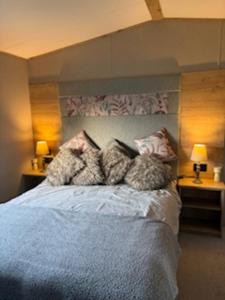 a bedroom with a bed with pillows on it at Honey's Retreat in Hull