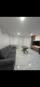 a living room with a couch and a coffee table at Apartamento alhelí 2 in Barbate
