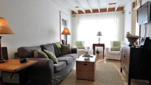 a living room with a couch and a tv at 639 Seagrove in Cape May Point
