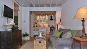 a living room with a couch and a kitchen at 639 Seagrove in Cape May Point