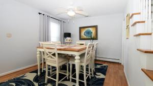 a dining room with a table and chairs at Life S A Beach in Cape May