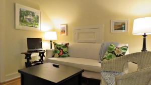 a living room with a couch and a tv at 637 Seagrove in Cape May Point