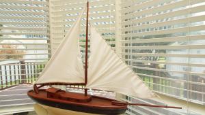 a model boat sitting on top of a balcony at Windsor Escape in Cape May