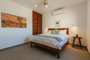 a bedroom with a bed and a painting on the wall at Baja Beach Pad at Cerritos in El Pescadero +20 photos