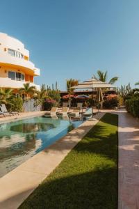a swimming pool in front of a building at Baja Beach Pad at Cerritos in El Pescadero