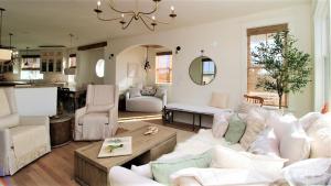 a living room with a couch and a table at 12 Pearls in Cape May Point