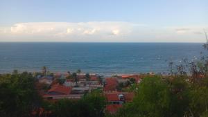 a view of a city and the ocean at Casa bela vista in Icapuí