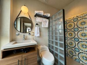 a bathroom with a sink and a mirror at Casa Filomeno in Mexico City +141 photos