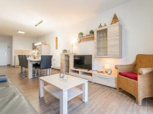 a living room with a couch and a table at Emma Top 2 in Dienten am Hochkönig