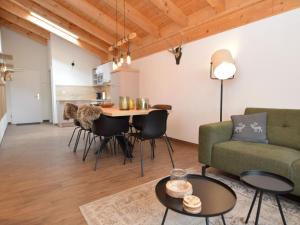 a living room with a couch and a table at Emma Top 4 in Dienten am Hochkönig