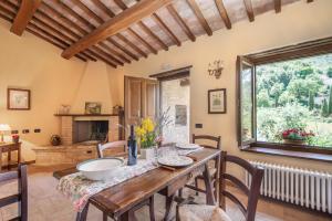a kitchen and dining room with a table and chairs at Casaletto ''La Lavanda'' in Bazzano Inferiore