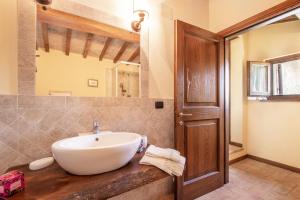 a bathroom with a white sink and a mirror at Casaletto ''La Lavanda'' in Bazzano Inferiore +10 photos