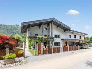 a house with a fence in front of it at Am Inn Fluss in Langkampfen