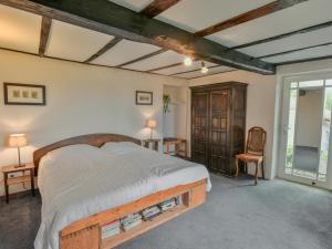 a bedroom with a large bed in a room at Lusignac Maswari in Lusignac +28 photos